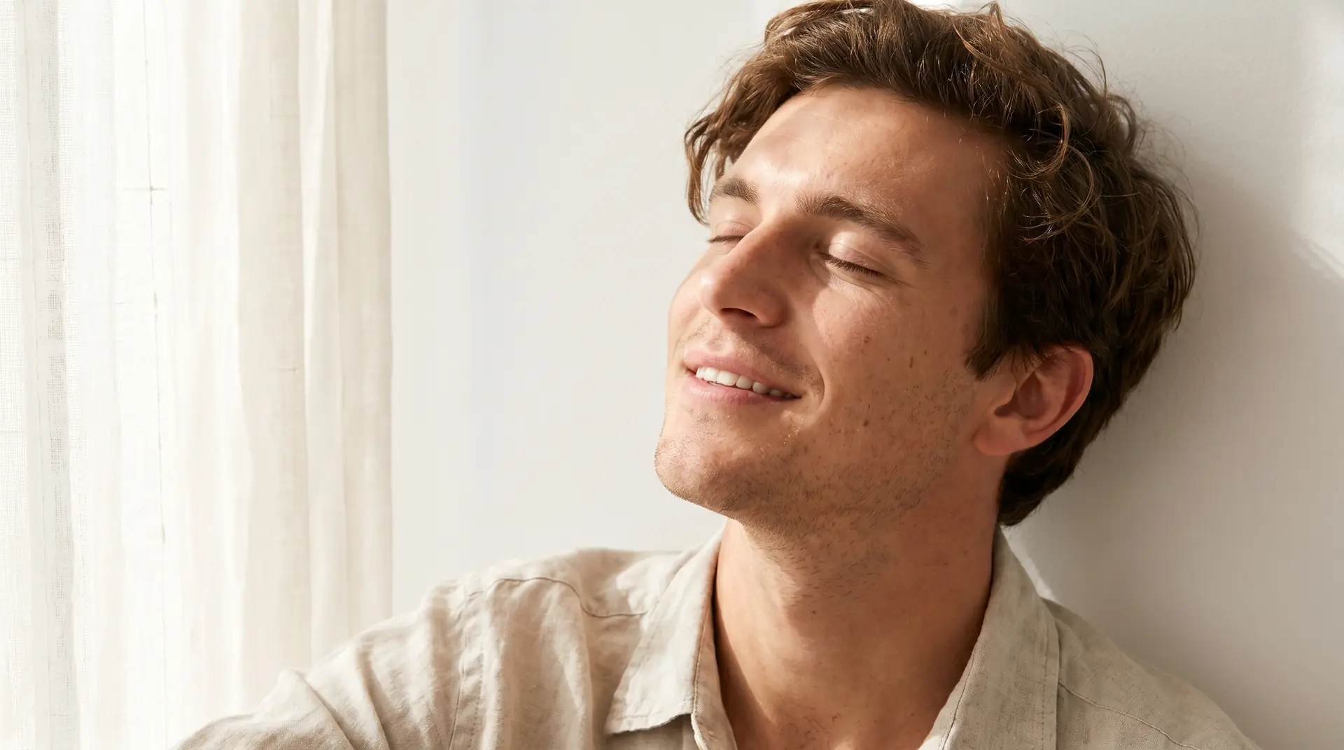 Young man with calm, clear skin after acne scar treatment in Tampa